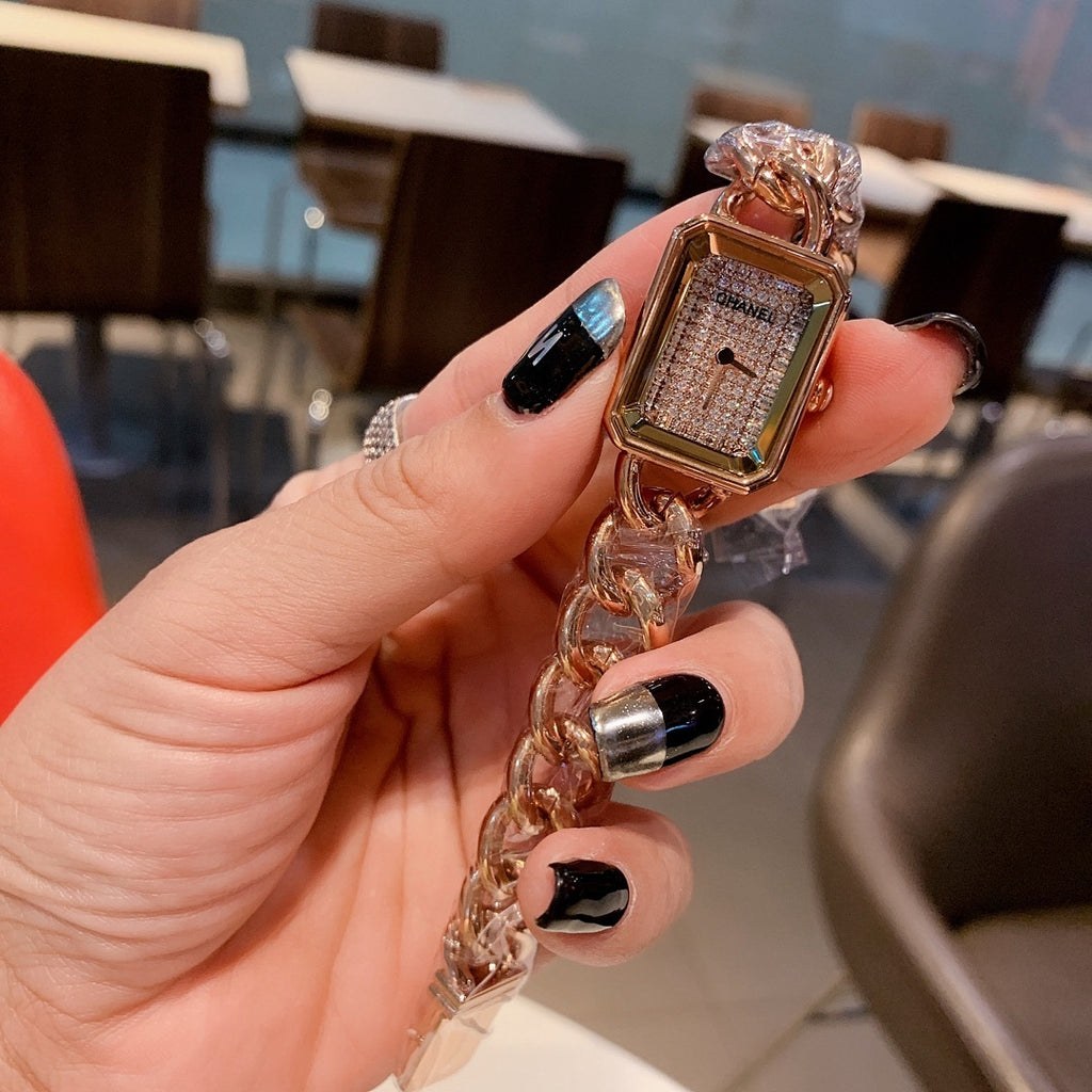 Rectangular wristwatch pendant on chunky gold chain with sparkling dial and gold bezel