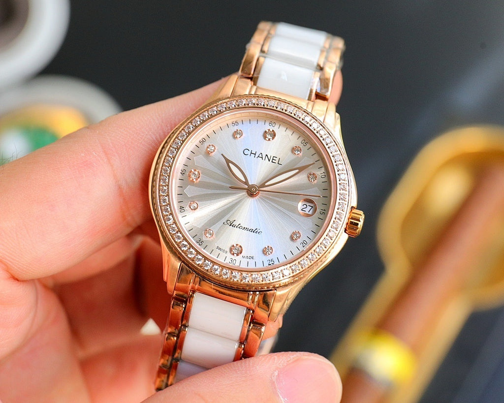 Chanel watch with white ceramic strap, rose-gold case, round white dial and date window