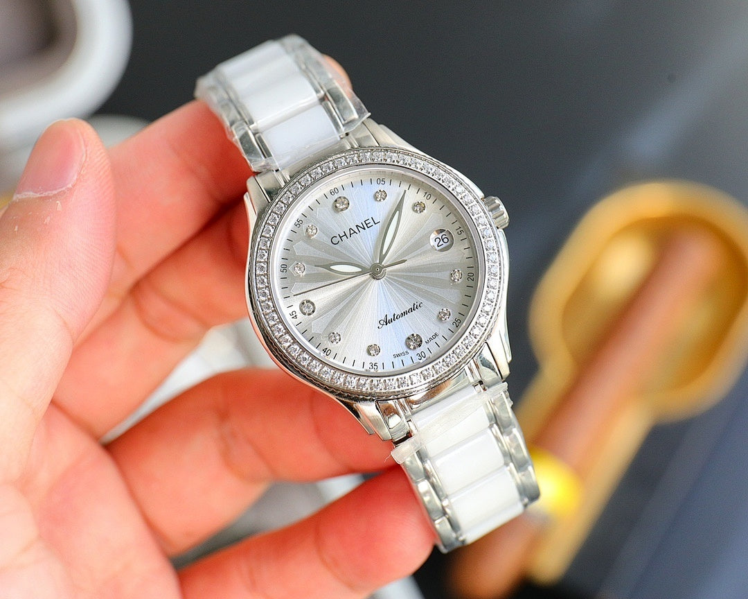 Chanel watch with white ceramic strap, silver-tone case, round white dial with bezel stones