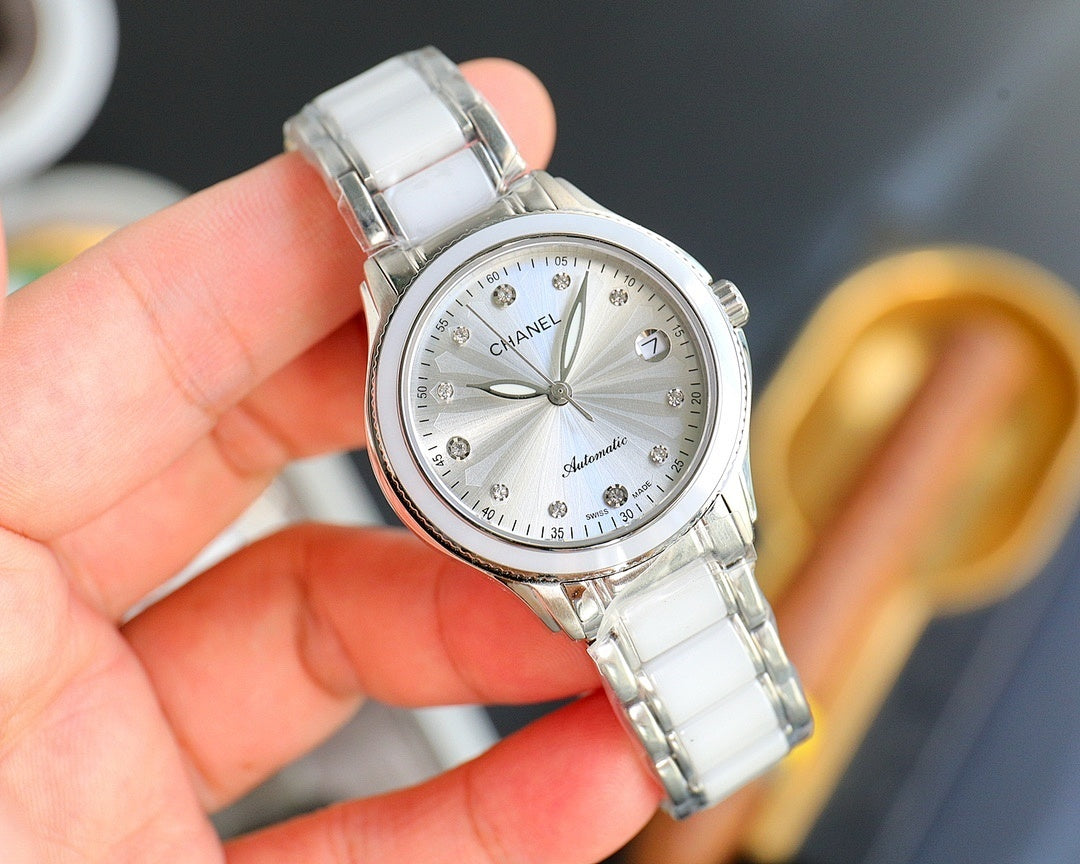 Chanel watch with white ceramic strap, silver-tone case, round white dial and date marker