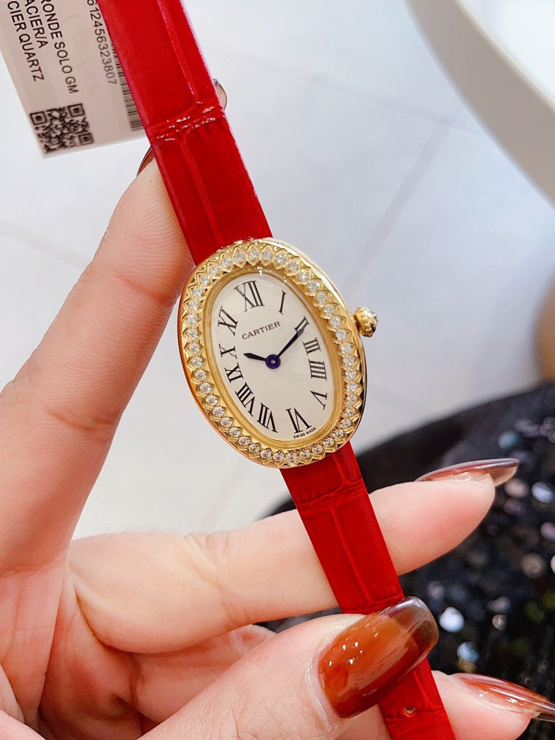 Oval wrist watch with red leather strap, jeweled bezel, Roman numeral dial, blue hands