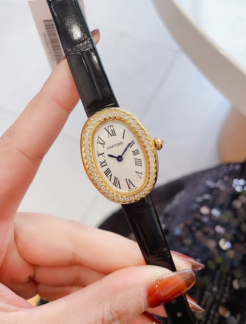 Oval wrist watch with black leather strap, jeweled bezel, Roman numeral dial, blue hands
