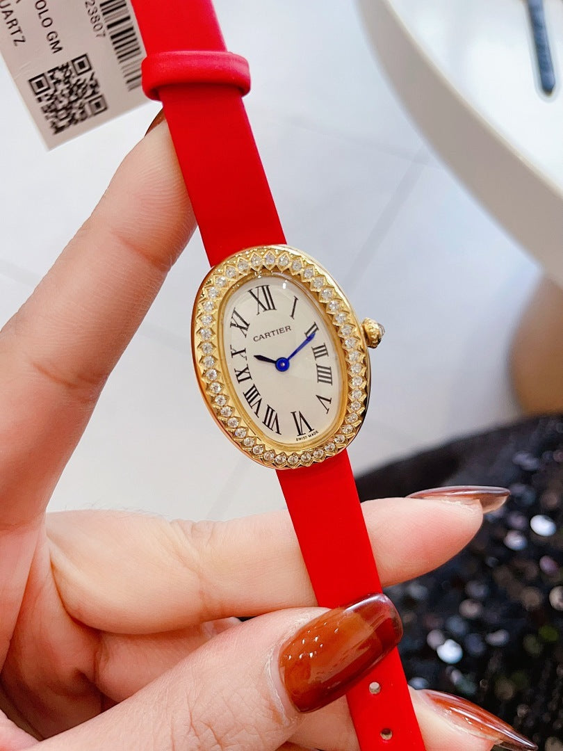 Oval wrist watch with bright red leather strap, jeweled bezel, Roman numeral dial, blue hands