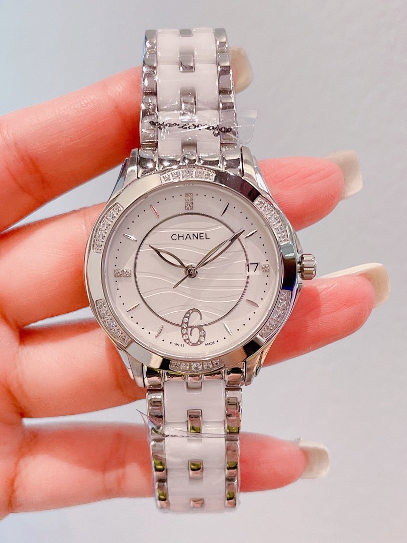 Chanel wristwatch with silver link bracelet, white dial, crystal-set bezel