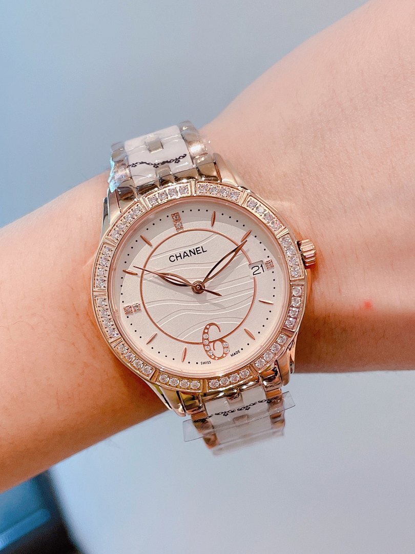 Chanel wristwatch with rose-gold diamond bezel, white dial, silver link bracelet