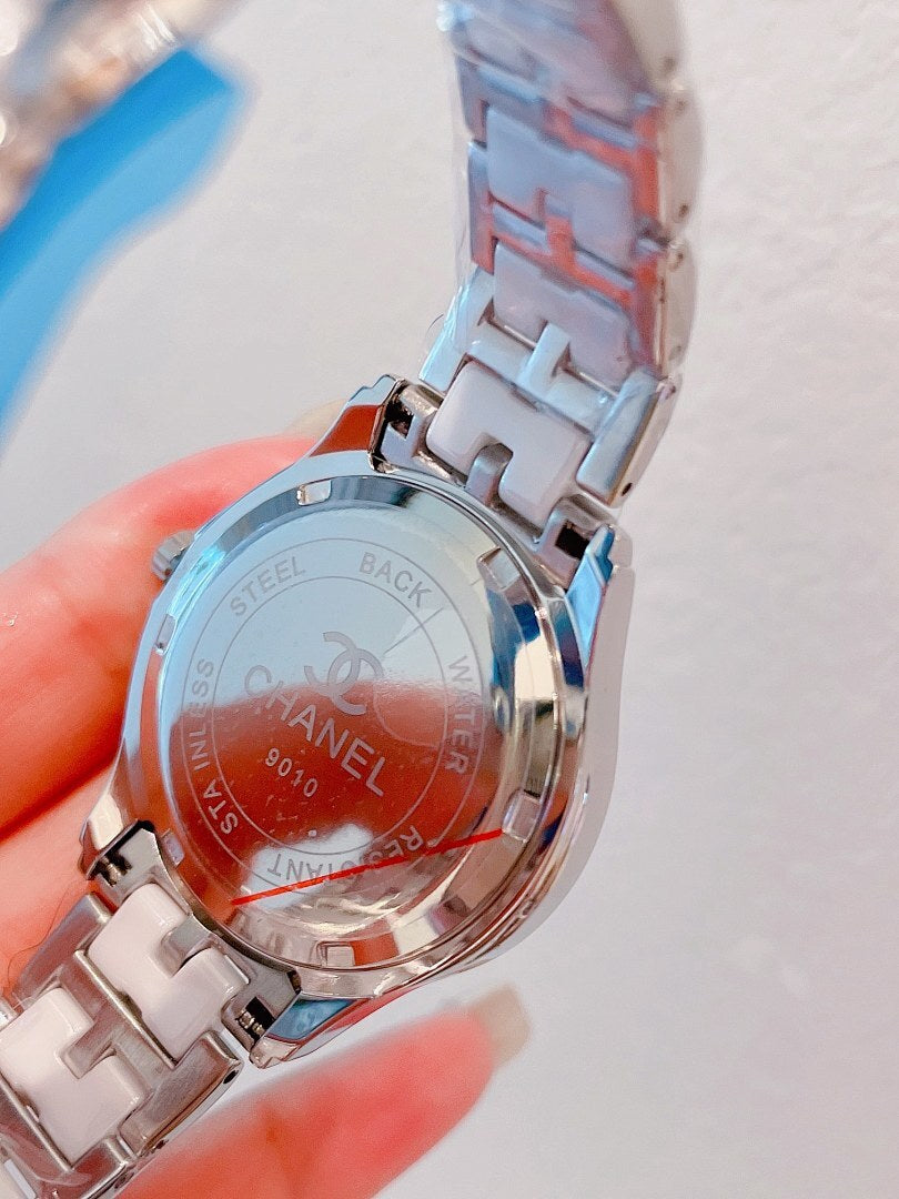 Chanel wristwatch with silver metal bracelet, engraved case back