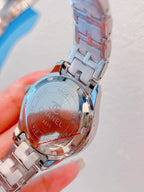 Chanel wristwatch with silver metal bracelet, engraved case back