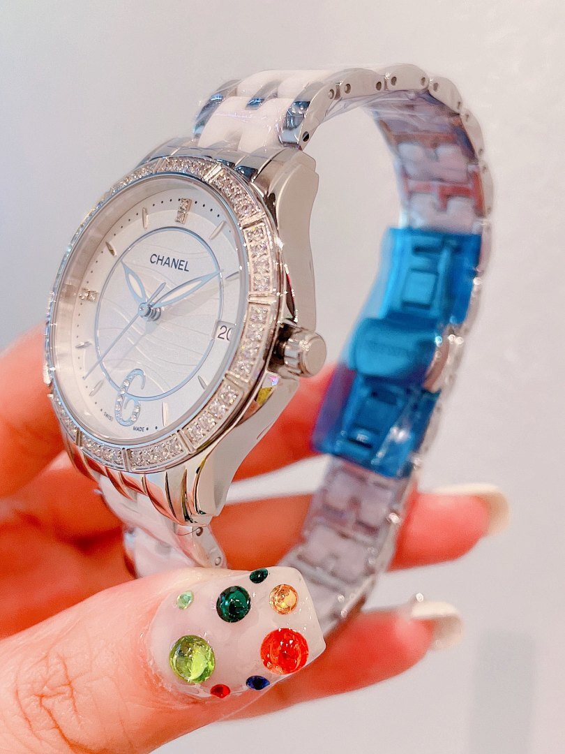 Chanel wristwatch with rose-gold diamond bezel, white dial, silver link strap