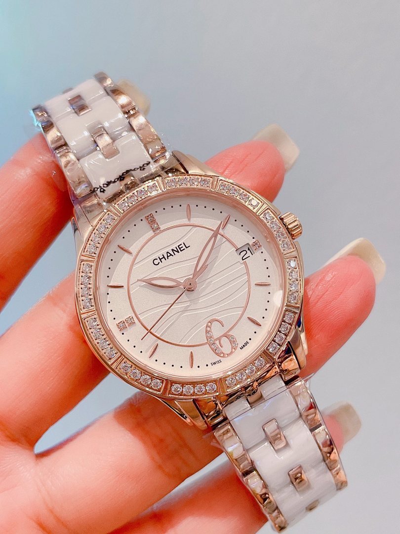 Chanel wristwatch with rose-gold diamond bezel, white dial, silver link band