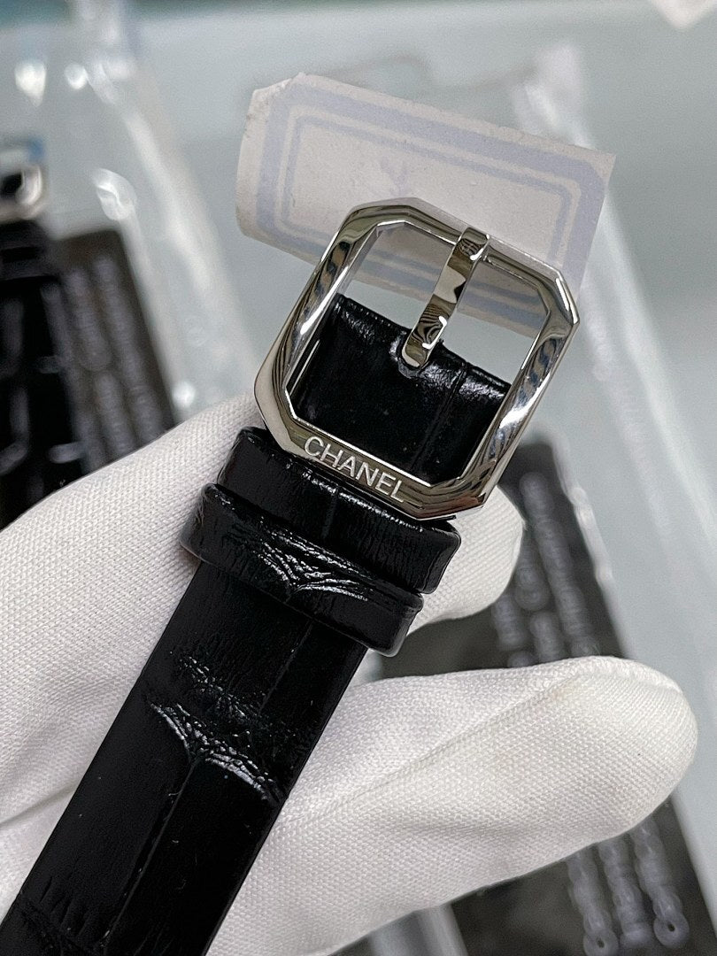 Square watch strap with black leather, silver buckle and clasp hardware