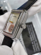 Square watch with black leather strap, silver case, rhinestone bezel, side crown