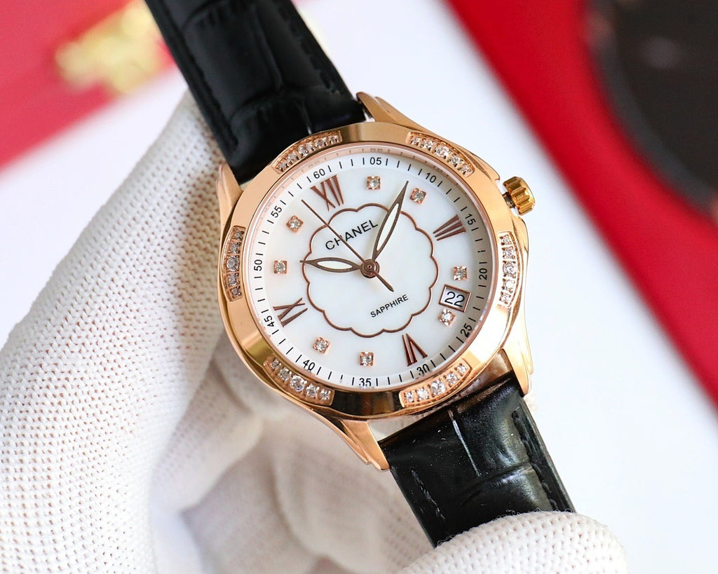 Chanel watch, black leather strap, rose-gold case, white clover dial