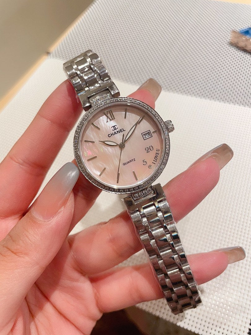Silver-tone Chanel wrist watch with metal bracelet, round white dial and Roman numerals