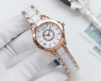 Rose gold analog wristwatch with white dial and metal link bracelet