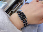 Chanel watch with black square dial and silver link bracelet