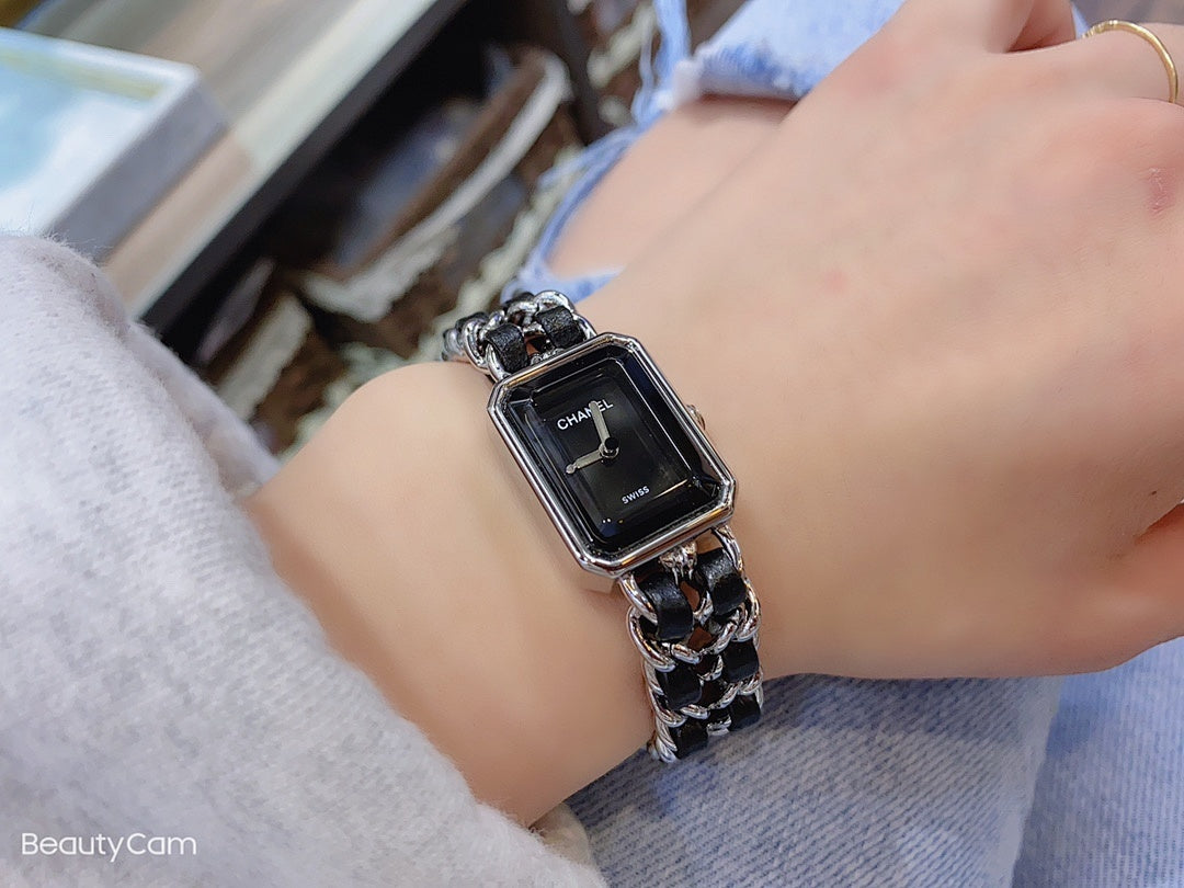 Chanel watch with black square dial and silver link bracelet