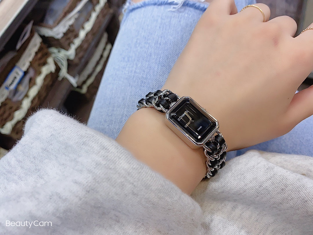 Wristwatch with black square dial and silver chain bracelet