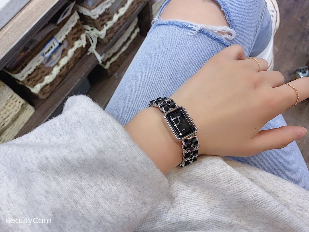 Square black dial wristwatch with silver link bracelet