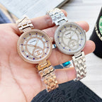 Two-tone CHANEL round watch with jeweled bezel and metal bracelet, white dial with blue markers