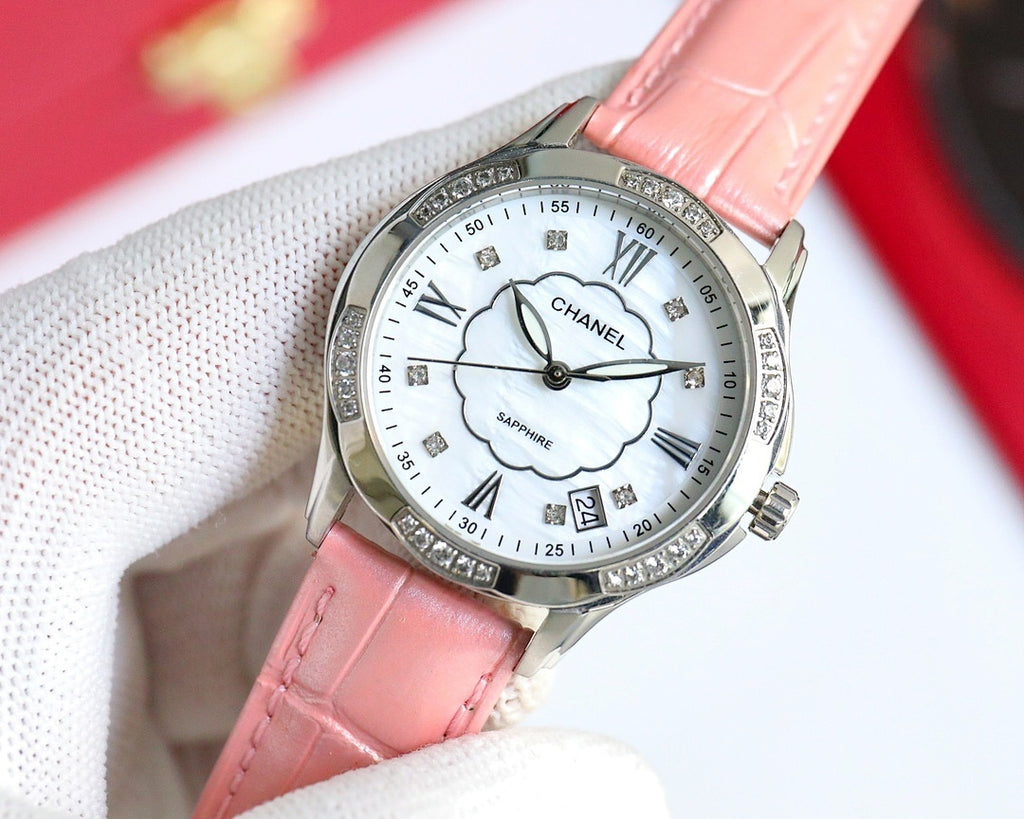 Chanel wristwatch with pink leather strap, white dial, Roman numerals, clover motif