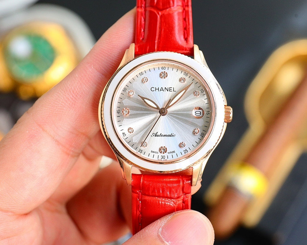 Chanel automatic watch with red leather strap and gold-tone case