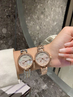 Chanel round wristwatch set with rose-gold and silver-tone metal links, white dial on wrist
