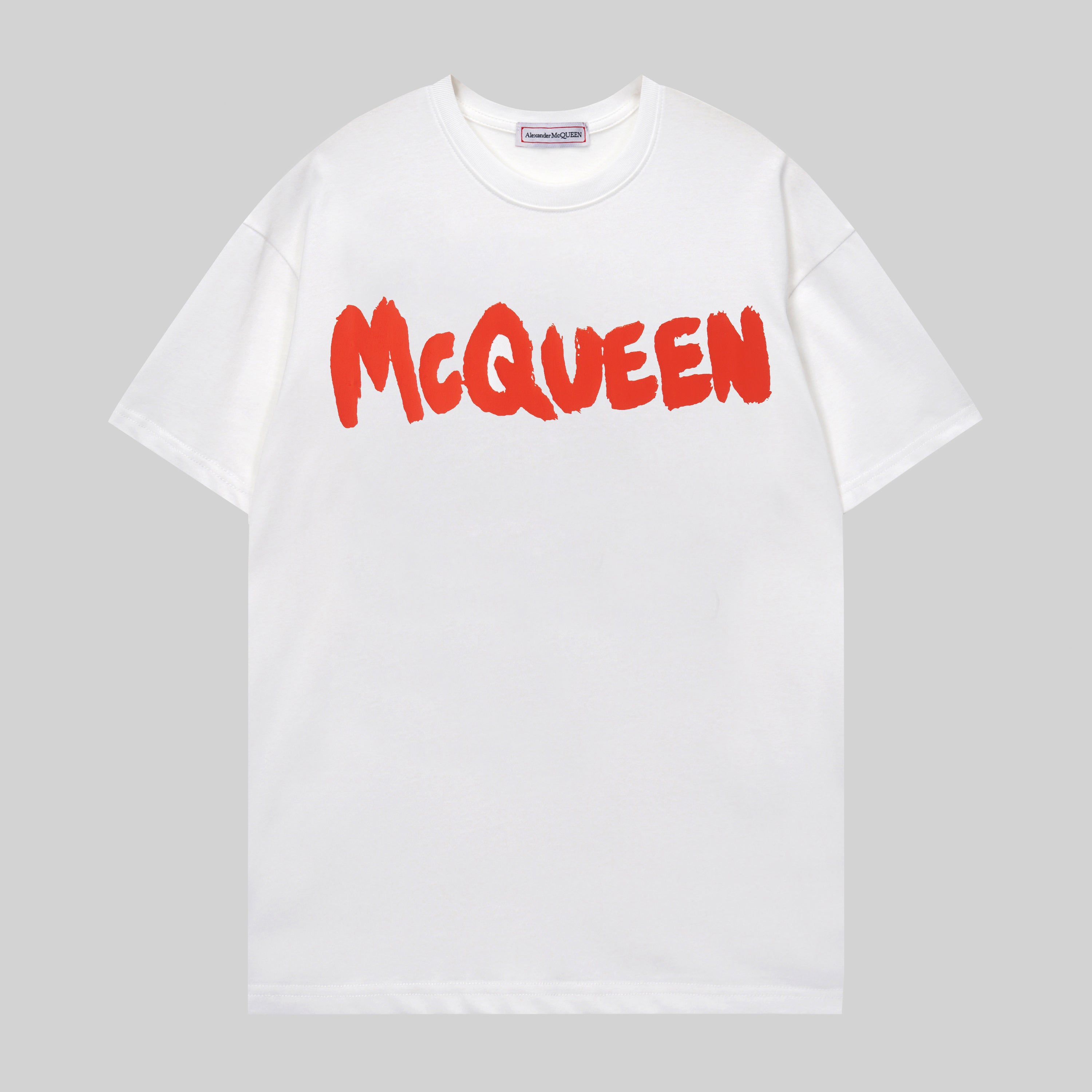 Alexander McQueen white T-shirt with red McQueen logo across chest