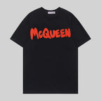 Alexander McQueen black T-shirt with red McQueen logo across chest