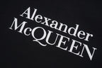 Alexander McQueen logo print on dark T-shirt fabric