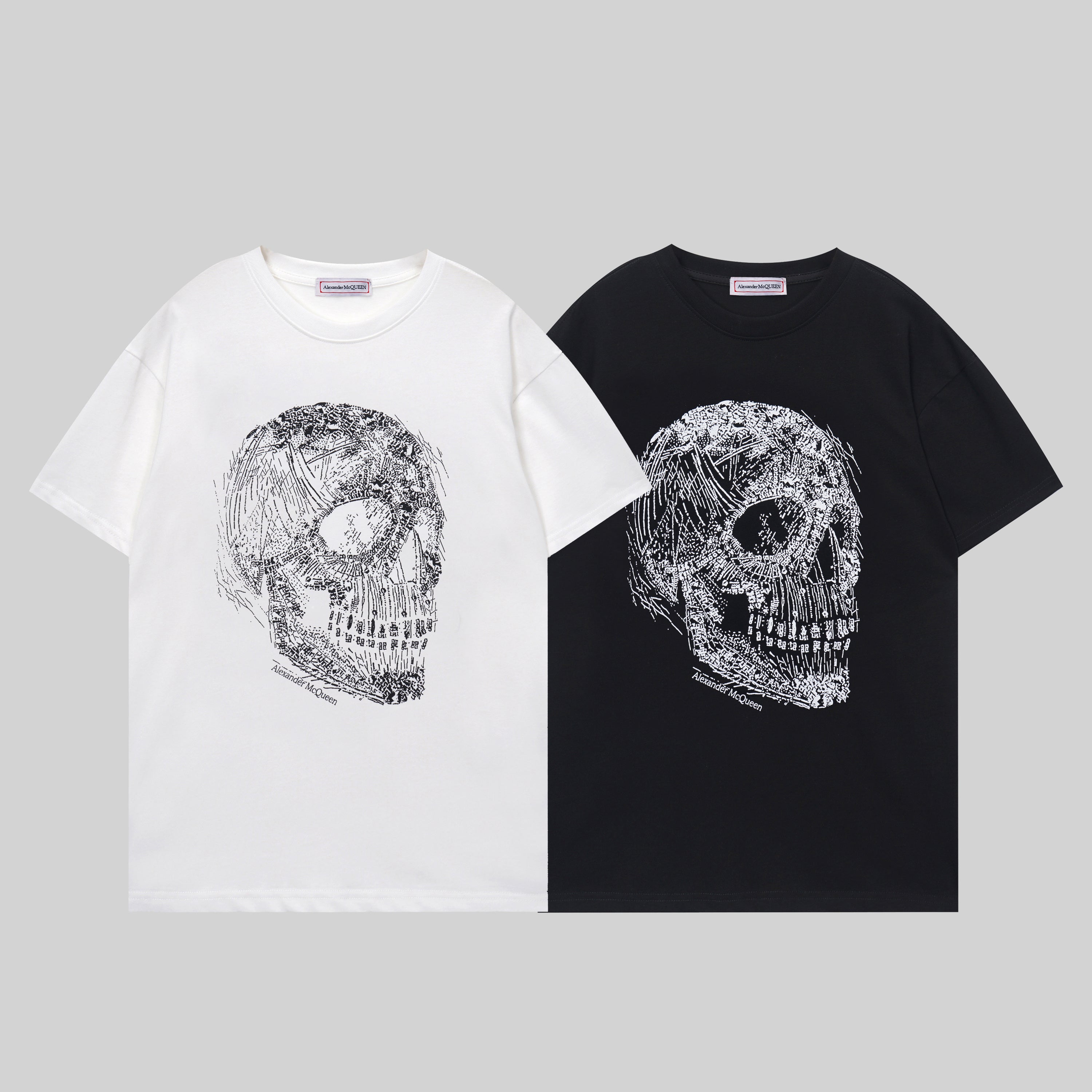 Alexander McQueen crewneck T-shirts, white and black, large silver skull chest graphic
