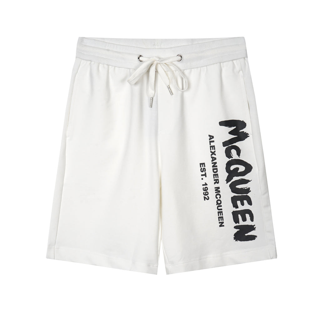 Drawstring shorts in white with black Alexander McQueen logo on right leg