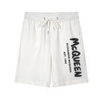 Drawstring shorts in white with black Alexander McQueen logo on right leg