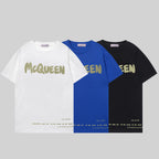 Set of three crewneck T-shirts with McQueen graphic in white, blue, and black