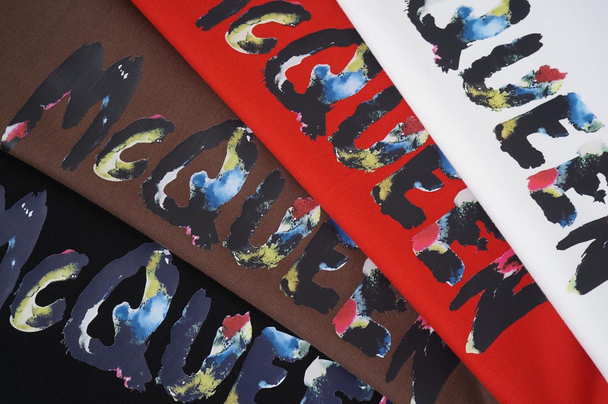 Alexander McQueen T-shirt fabric with multicolor McQueen lettering on red and brown