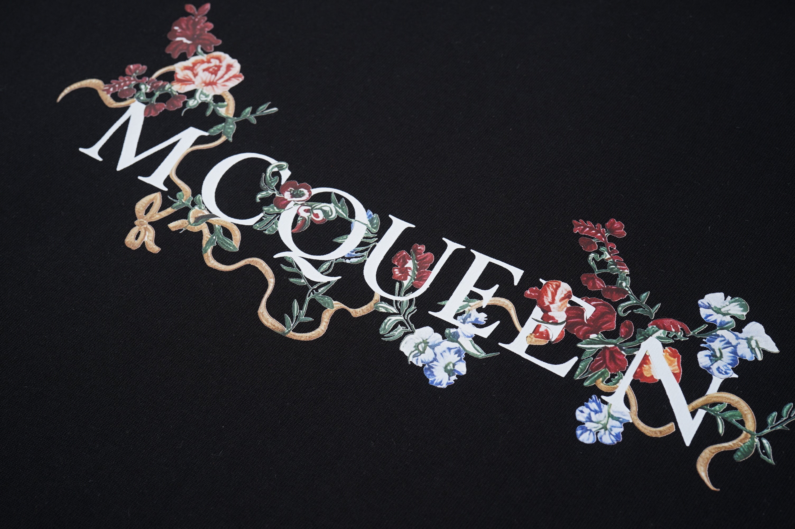 Alexander McQueen floral lettering graphic on black T-shirt