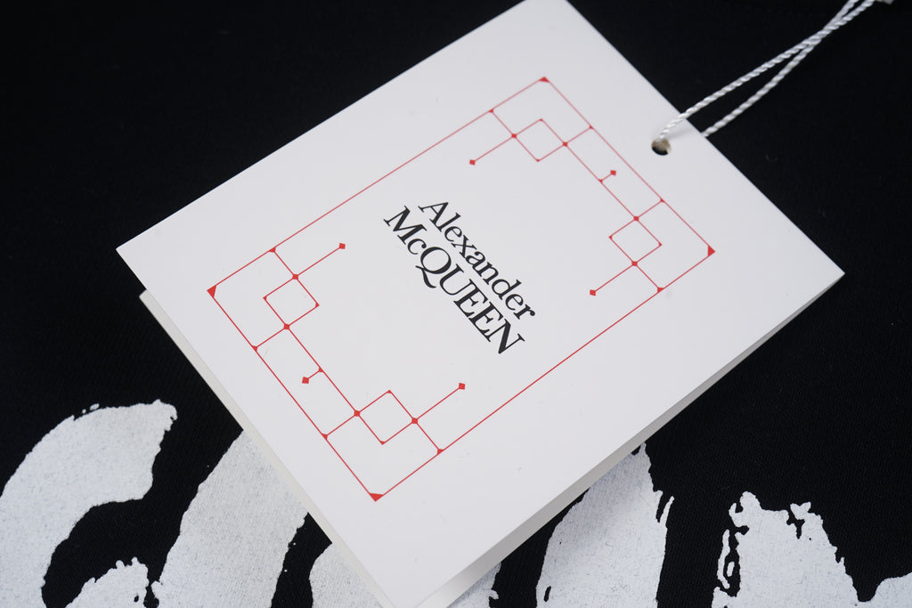 Alexander McQueen hang tag with logo text