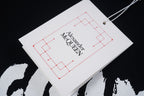 Alexander McQueen hang tag with logo text
