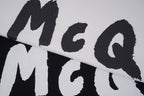 Alexander McQueen T-shirt close-up, black McQ letters on light fabric