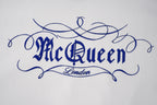 Light hoodie fabric with blue embroidered 'McQueen' logo and 'London' detail