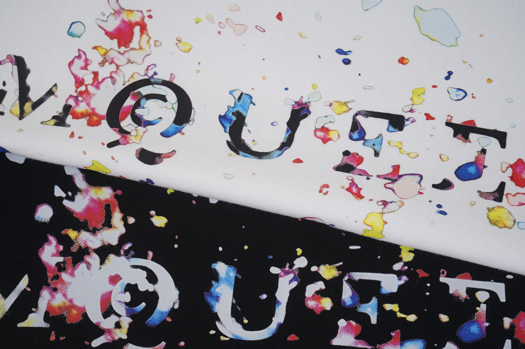 Alexander McQueen T-shirt fabric close-up with colorful splatter logo print