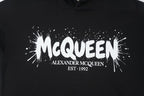 Black Alexander McQueen hoodie with large front logo print and drawstring hood.