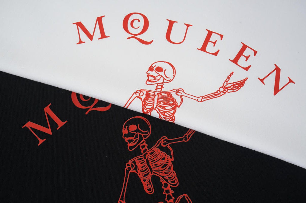 Alexander McQueen T-shirt graphic close-up, red skeleton on white and black fabric