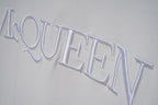 White short-sleeve T-shirt close-up of McQUEEN logo lettering