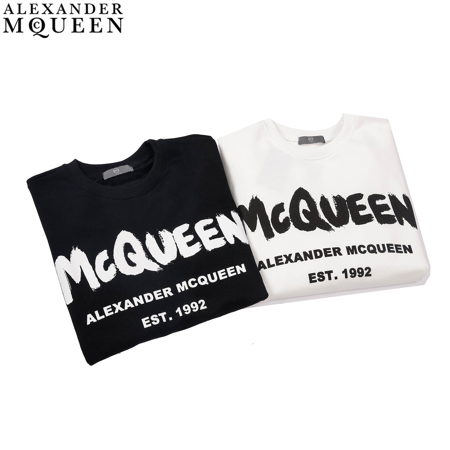 Crewneck sweatshirts, black and white with McQueen front logo and EST.1992