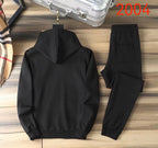 Back view of black MM6 hoodie with matching black jogger pants