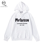 White pullover hoodie with McQueen lettering and Alexander McQueen logo on chest.