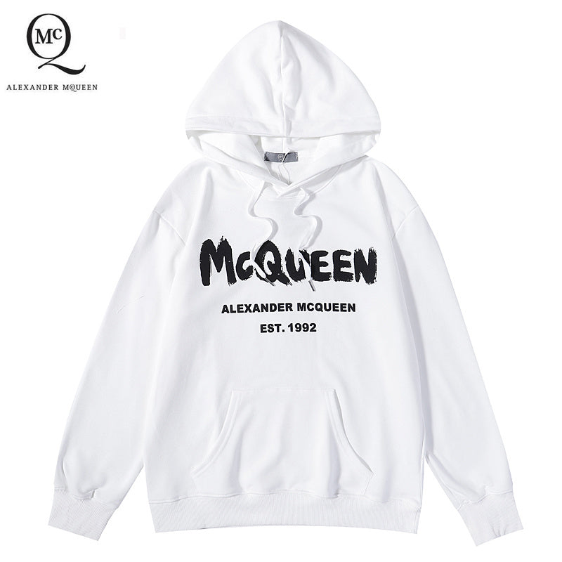 White pullover hoodie with McQueen lettering and Alexander McQueen logo on chest.