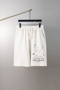 White drawstring shorts with elastic waistband and number chart graphic