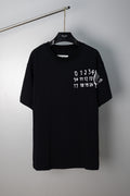 Black crew-neck T-shirt with white number graphic on chest