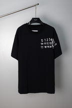 Black crew-neck T-shirt with white number graphic on chest